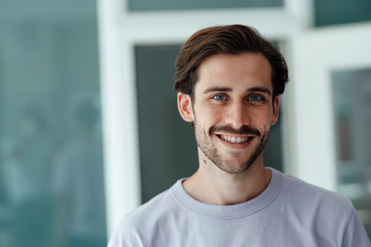 Smiling young man at home