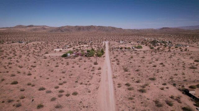 Joshua Tree California Dirt road with houses in desert. Aerial view - stock video