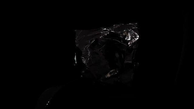 Stunning black gemstone with gorgeous light reflections falling across it.