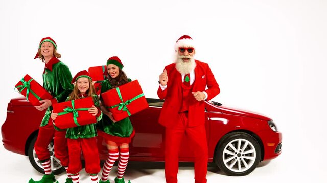 Funky positive elf santa team enjoy dance prepare gift cabriolet delivery
