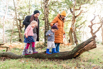 Happy family exploring outdoors in autumn