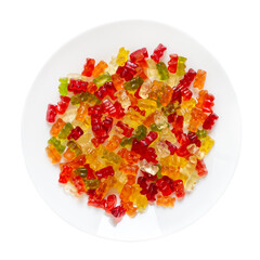 Jelly bears on a plate isolated on a white background. Traditional fruit gummies. Top view.