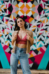 Caucasian woman posing in front of colorful background. Young and attractive model.