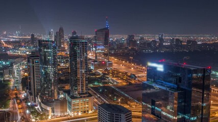 Aerial view of media city and al barsha heights district area all night timelapse from Dubai marina. - Powered by Adobe