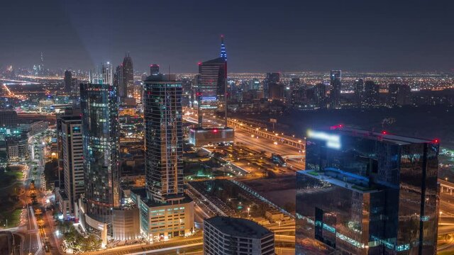 Aerial view of media city and al barsha heights district area all night timelapse from Dubai marina.