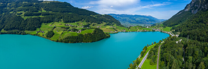Fototapeta na wymiar Aerial view around the lake Lungernersee in Switzerland on a sunny day in summer. 