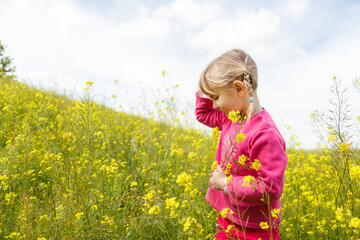 little blondie girl picking flowers