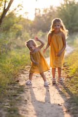 Fototapeta premium Two girls, seven years old and one age