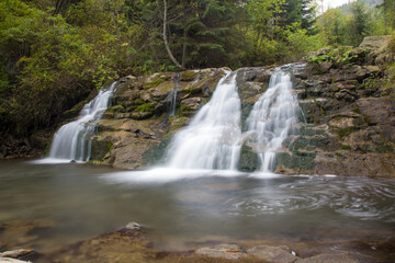 Fototapeta na wymiar mountain waterfall in the forest