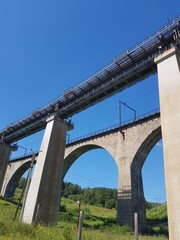 Ancient railway bridges run above the ground