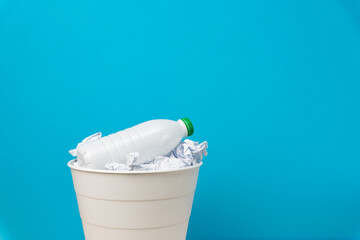 Throw plastic in the trash, bottom view. Plastic bottle