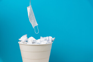 Find the mask from the trash. Throw the mask