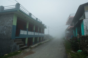 Fototapeta na wymiar Empty foggy street in the morning, Pokhara, Nepal