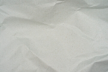 Natural recycled paper or paperwork closeup of wrinkle texture shiny work sheet.