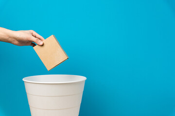 The cardboard boxes are thrown into the trash for disposal