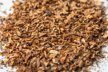 Heaps of tobacco on a white background. Tobacco products
