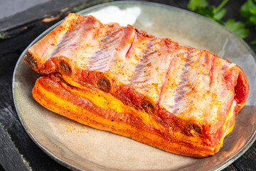 raw ribs pork meat pickled spices and herbs fresh portion ready to eat meal snack on the table copy space food background rustic. top view keto or paleo diet