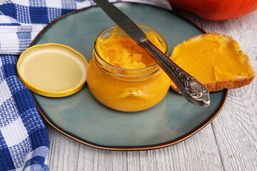 Homemade pumpkin butter in glass jar made with organic pumpkins