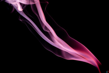 Obraz premium Abstract colorful smoke on a black background. Isolated.
