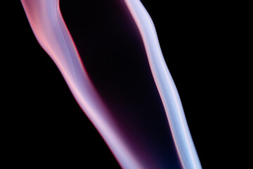 Obraz premium Abstract colorful smoke on a black background. Isolated.
