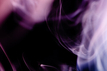 Abstract colorful smoke on a black background. Isolated.