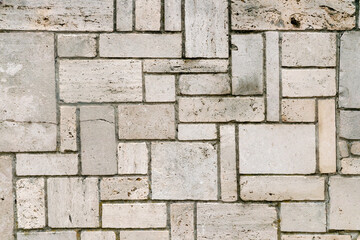 Texture of even masonry fence or horizontal surface.