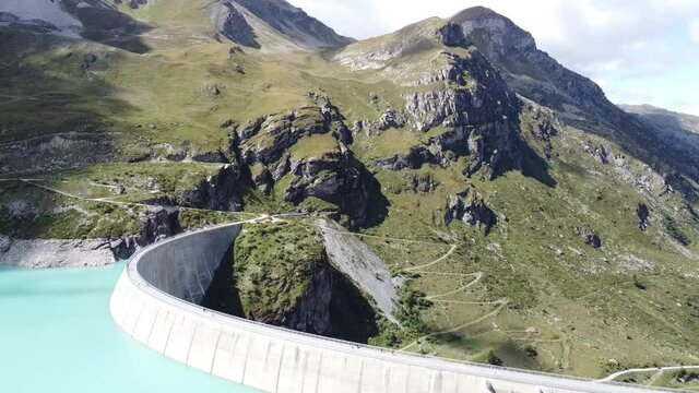 drone flight over the dam wall of the beautiful lac de moiry in the Swiss mountains, super landscape