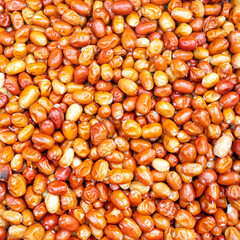 Texture of red dried berries on the market counter.