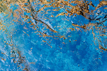 Abstract texture reflection of a bright sky in seething