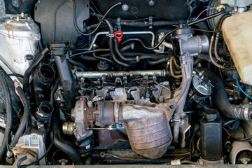 Fototapeta na wymiar Car under the hood: view of the internal combustion engine