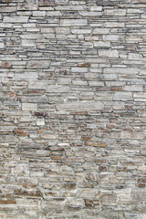 Texture of even masonry fence or horizontal surface.