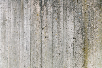 Fototapeta premium Texture of gray concrete wall with traces of wooden formwork.