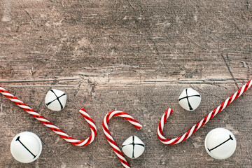 Candy Canes and Jingle Bells on Brown Wood