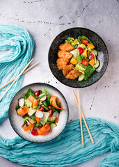 Fresh vegetable salads on table flat lay. Top view on kitchen table with two dishes Restaurant, menu, buffet concept