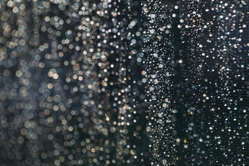 Rain drops background in dark time of day