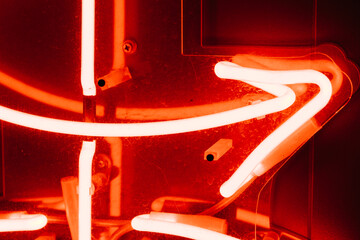 Abstract neon pipes in red color. Part of a neon sign