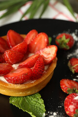 Concept of delicious food with strawberry tart, close up