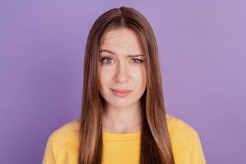 Portrait of doubtful clueless confused lady raise eyebrow puzzled face on violet background