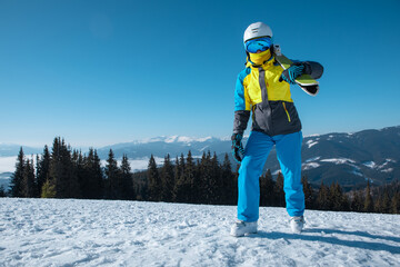 Fototapeta na wymiar woman skier portrait with ski on the top of the mountains