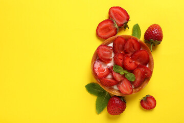Delicious strawberry tart on yellow background, space for text