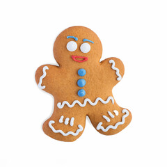 Gingerbread man, decorated with colored glaze, isolated on a white background. Christmas ginger cookies.