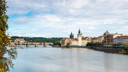 Fototapeta na wymiar Prague, Czech Republic. A view over the Vlatava River with the Charles Bridge and Old Town Bridge Tower in the distance.