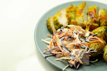 Pesto and mozzarella chicken breast fillet with herby baby potatoes and creamy coleslaw salad