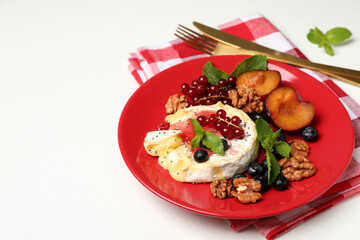 Concept of tasty food with grilled camembert on white background