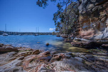 Stacked long exposure of beautiful turquoise and blue waters of Beauty Point  Mosman on a Spring morning with yachts and houses in background NSW Australia