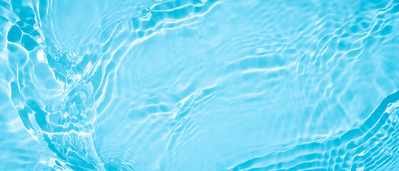 Transparent blue clear water surface texture with ripples, splashes and bubbles. Abstract summer...