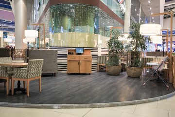 The wooden empty table top on blurred cafe background.