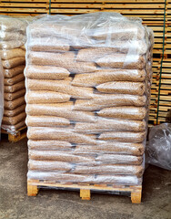 Fuel pellets are packed in bags, lie on pallets
