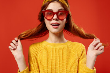 woman holding hair in red glasses fashion studio retro style