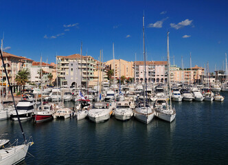 Fototapeta na wymiar Luxurious Boats In The Yachting Harbour Of Frejus In France On A Beautiful Spring Day With A Clear Blue Sky